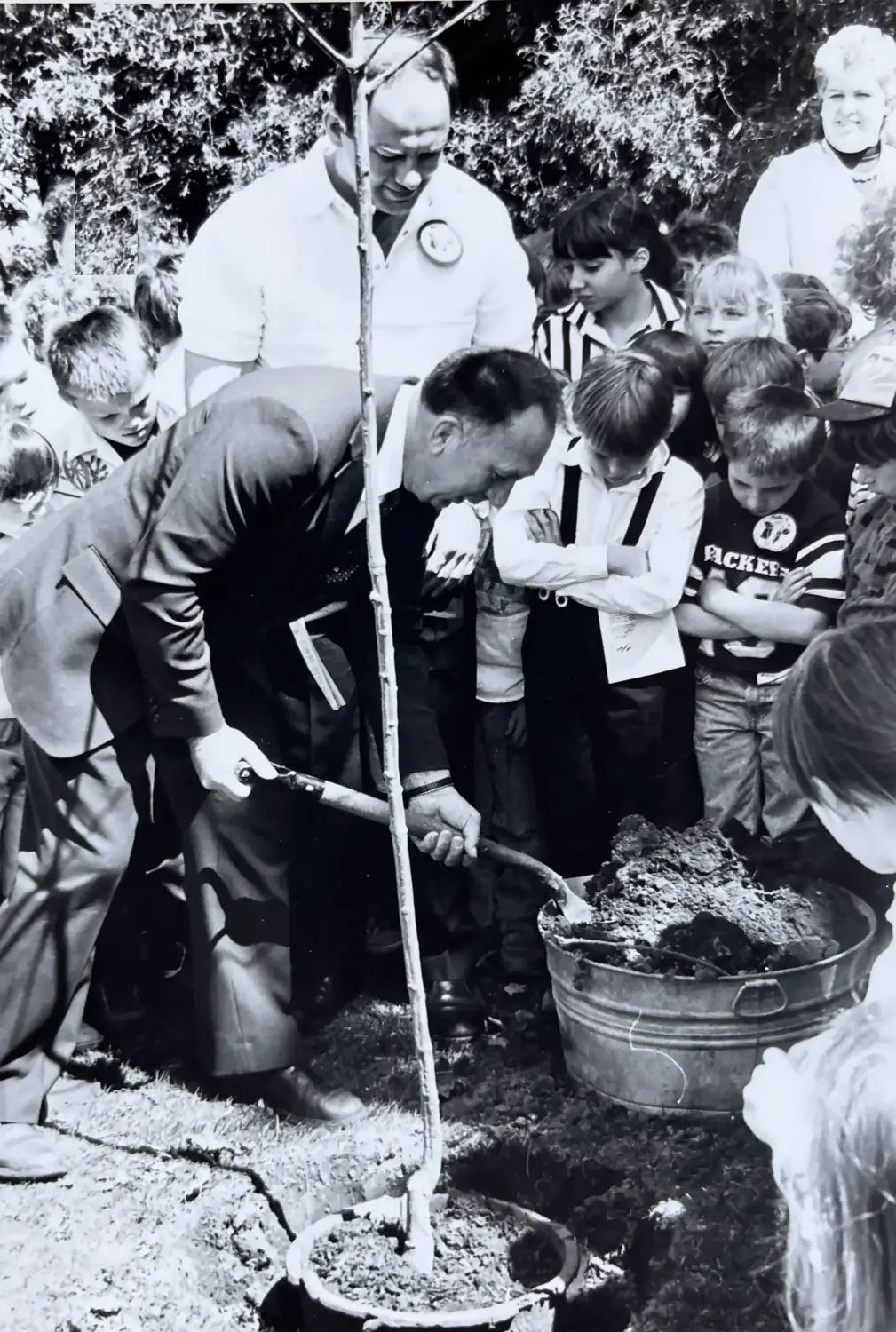 Carl Scholz planting a tree in Door County Wisconsin