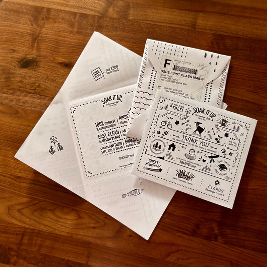 White paper envelopes with black ink designs from soakitup feature eco-friendly packaging for sustainable home use