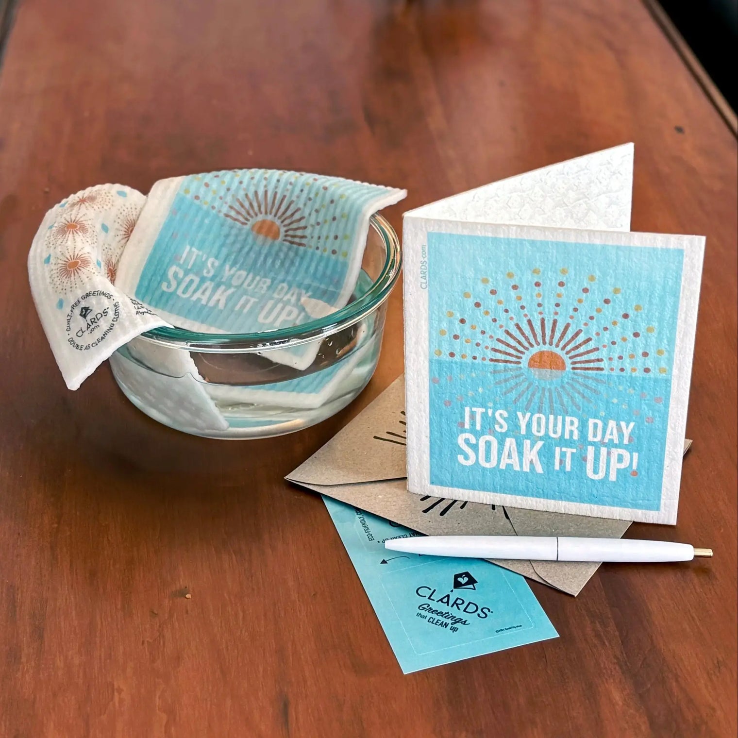 Blue and white patterned clards reusable sponge with sunburst design featured in brilliant business ideas article