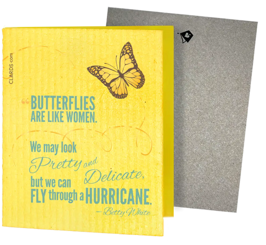 Yellow sponge cloth with butterfly print and teal betty white quote featuring two reusable swedish sponge cloths