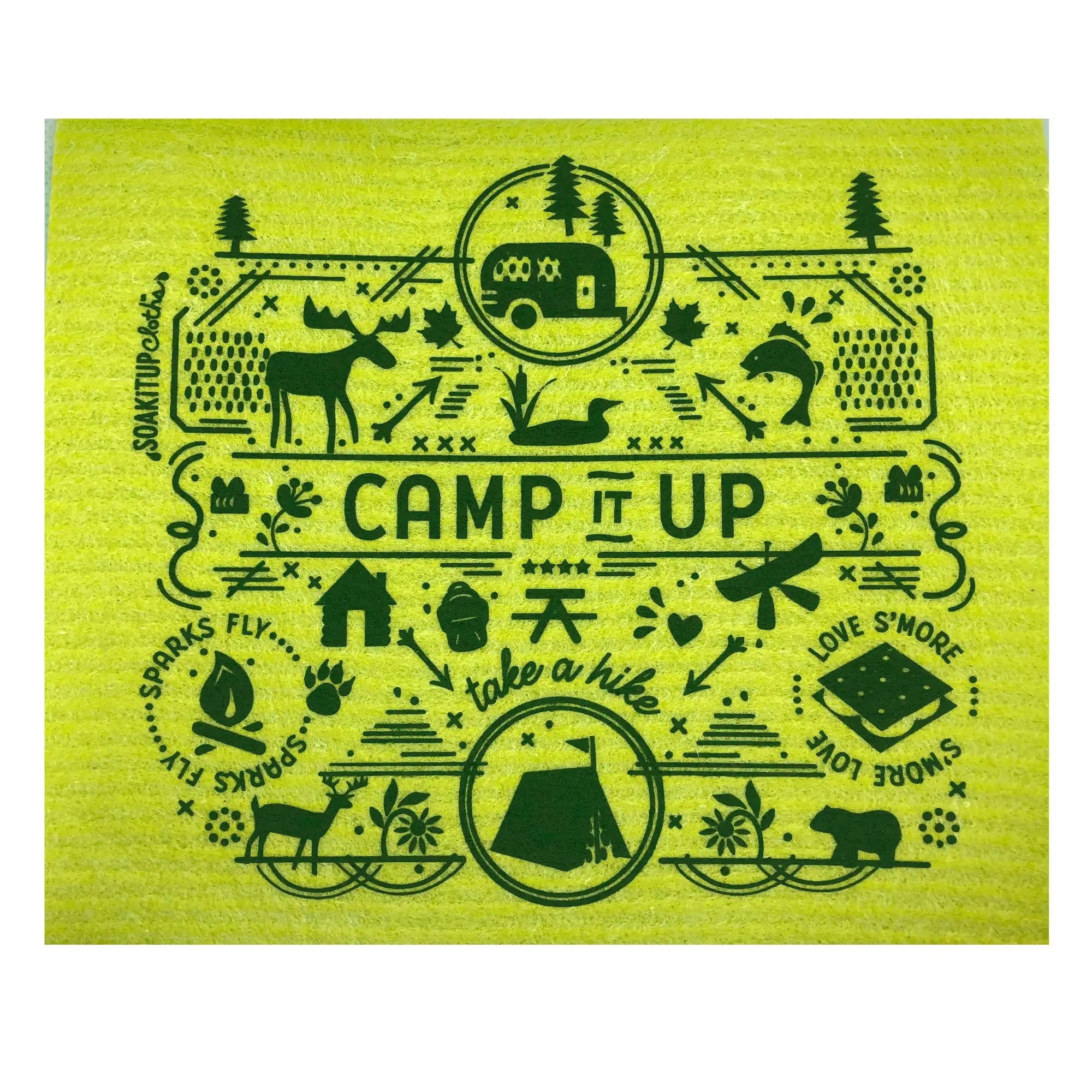 Green Swedish dishcloth with green camping-themed designs and Camp It Up take a hike, sparks fly, love s'more text.