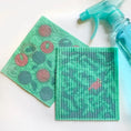 Load image into Gallery viewer, Green textured reusable swedish sponge cloths with pink and gray circular bird patterns from soak it up clards
