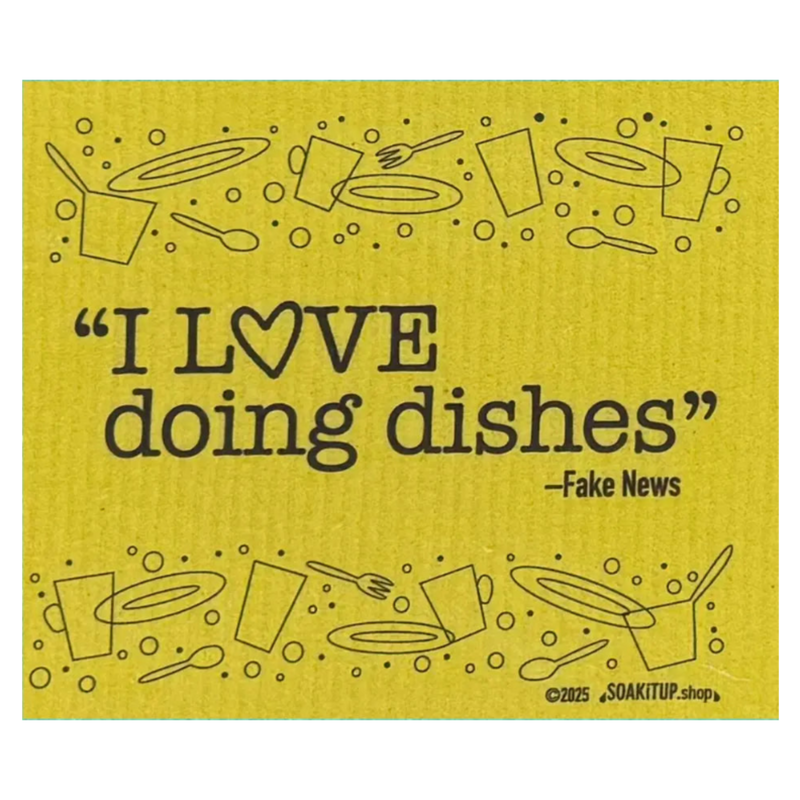 Yellow towel with kitchen utensils and text 'I LOVE doing dishes - Fake News' on a yellow background