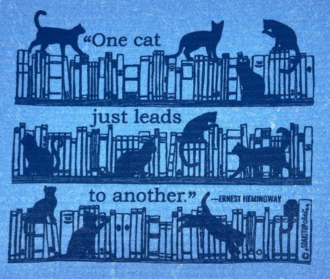"one cat just leads to another"–Ernest Hemingway cute cats in bookshelves blue Swedish dishcloth