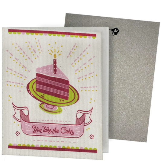 Clards eco-friendly greeting card - cake illustration and text 'You take the cake'  - turns into 2 reusable sponge cleaning on a white background