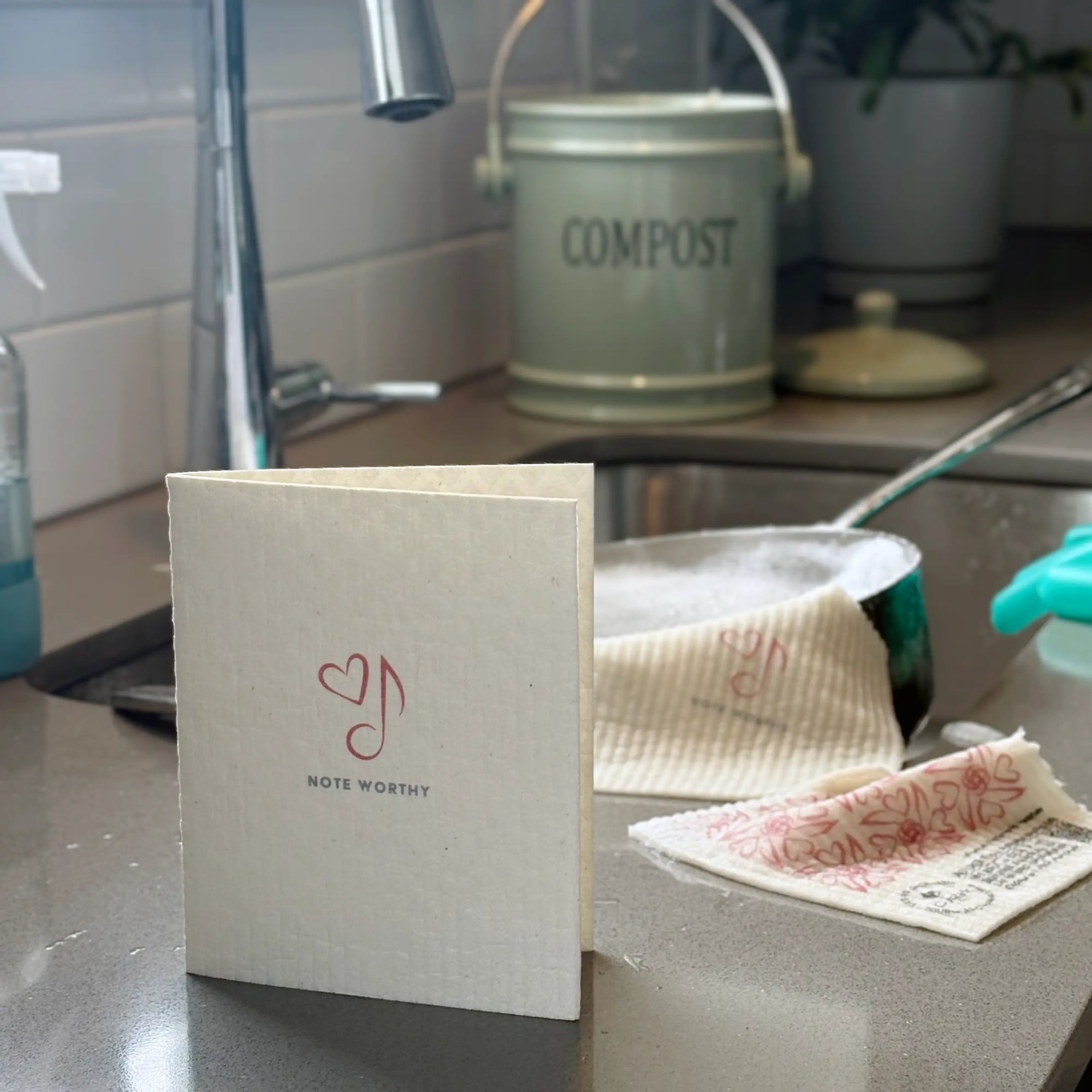 Note Worthy 2-in-1 in use at sink Greeting Clard® turns into reusable cleaning cloth soakitup.shop